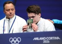 Moment emo?ionant la Milano: americanul Maxim Naumov, cu poza p?rin?ilor s?i, deceda?i intr-un accident aviatic:&nbsp;(…)